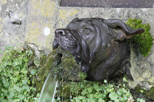 The moss-covered "Devil Dog" fountain, located in Belleau, France, symbolizes the spirit of the Marines who fought there in World War I. —Marine Corps photo by Sgt. Lisa R. Strickland