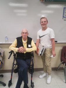 Pete, pictured here with Semper K9 volunteer AJ, in April 2017 at Benton Middle School for a history class. AJ and his family will be the K9 Coaches for Semper K9's Pete.